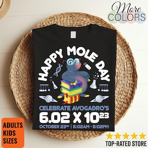 May include: Black t-shirt with a graphic featuring a cartoon mole wearing glasses, surrounded by science-themed illustrations. The text reads "HAPPY MOLE DAY" and "CELEBRATE AVOGADRO'S 6.02 X 10^23". Includes the date and time of the event.