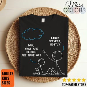 May include: Black t-shirt with a humorous graphic featuring stick figures and text. The text reads "DAD, WHAT ARE CLOUDS ARE MADE OF?" and "LINUX SERVERS, MOSTLY". The shirt also has the words "More Colors", "ADULTS KIDS SIZES", and "TOP-RATED STORE".