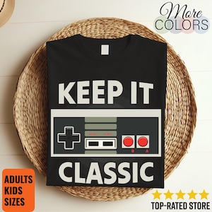 May include: A set of three ceramic mugs with a speckled, matte finish. The mugs are in shades of cream, light gray, and dark gray. Each mug has a simple, minimalist design and a rounded handle.