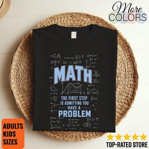 May include: A black short-sleeved t-shirt featuring the light blue text MATH and THE FIRST STEP IS ADMITTING YOU HAVE A PROBLEM, surrounded by various white mathematical formulas, equations, and a graph of a function on a coordinate plane.