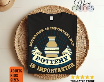 May include: Black t-shirt with a pottery-themed graphic. The design includes a pottery vessel, banner, and text that reads "Education is important but pottery is importanter." Additional text indicates adult and kids sizes are available.