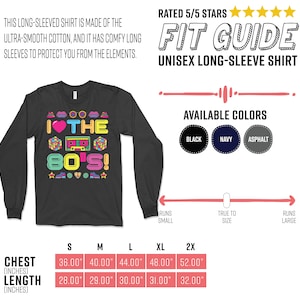 Puede incluir: Una camiseta de manga larga negra con un gr&aacute;fico colorido que dice "I &hearts; THE 80'S!" El gr&aacute;fico incluye una cinta de casete, un coraz&oacute;n y un cubo de Rubik. La camiseta est&aacute; disponible en negro, azul marino y asfalto. La tabla de tallas muestra las medidas de pecho y longitud en pulgadas.