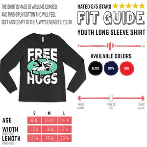 May include: Black long-sleeve youth shirt with the text "FREE HUGS" and a graphic of two people hugging. The shirt is available in sizes S, M, and L. The size chart shows the age range, width, and length in inches for each size.