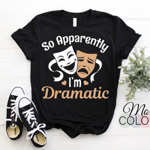 May include: Black t-shirt with a white and brown graphic of two theater masks and the text "So Apparently I'm Dramatic".