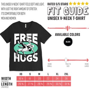 May include: Black v-neck t-shirt with a graphic of two wrestlers in a green circle and the text "FREE HUGS". The shirt is available in sizes XS to 2XL. The size chart shows the width and length of the shirt in inches.