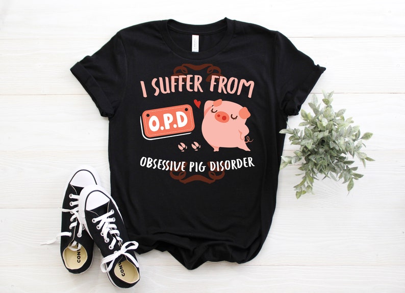 May include: Black t-shirt with a pig illustration and the text "I suffer from O.P.D. Obsessive Pig Disorder".