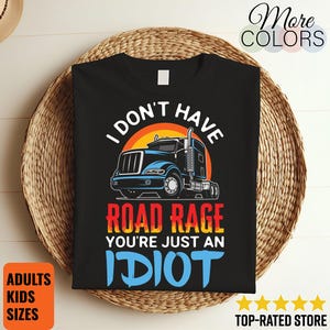 May include: Black t-shirt with a graphic of a semi-truck and the text "I DON'T HAVE ROAD RAGE YOU'RE JUST AN IDIOT." The design features a sunset background. The shirt is available in adult and kids sizes.
