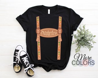 May include: Black t-shirt with a graphic of brown suspenders with Oktoberfest written on a brown oval. The suspenders are decorated with pretzels, mustard, and hops.