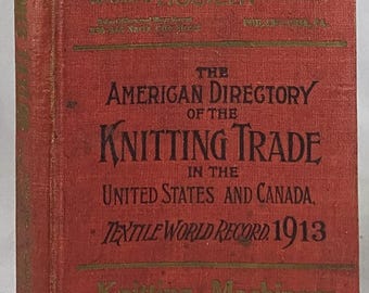 May include: A vintage red book titled "The American Directory of the Knitting Trade in the United States and Canada, Textile World Record 1913." Gold lettering and text details the book's publisher and subject matter.