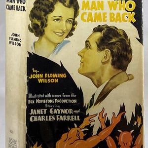 May include: Vintage book cover for "The Man Who Came Back" by John Fleming Wilson. The cover features illustrations of a man and woman, with text in yellow and black. The book is a Grosset & Dunlap edition.
