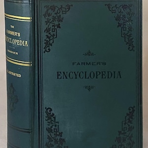 May include: A dark green hardcover book titled The Farmer's Encyclopedia by Magner. The front cover features black embossed floral corner details and the title in black text. The spine displays gold lettering and horizontal lines on a green background.