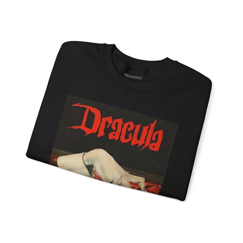 Step into the haunting world of classic literature with our Vintage Bram Stoker's "Dracula" Book Cover Sweatshirts and Hoodies. These cozy garments pay tribute to the timeless tale of the undead.