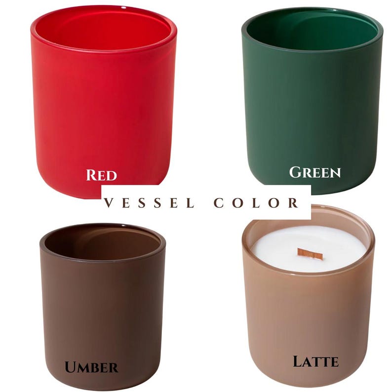 May include: Four cylindrical candle vessels labeled VESSEL COLOR, featuring a red, green, umber, and latte finish. The latte vessel contains white wax and a wooden wick. Each container has a smooth, matte-like texture and a simple, open-top design.