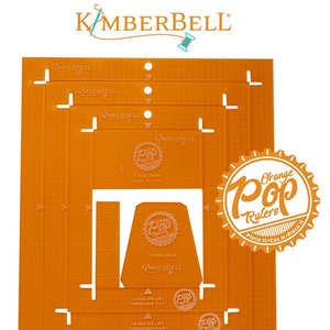 May include: Orange quilting ruler set with a grid pattern and markings for cutting fabric. The ruler set includes a tumbler block, flying geese, and other shapes. The rulers are labeled "Pop Rulers" and "Place It - Cut It - Piece It".