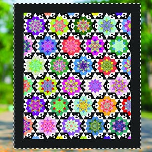 May include: A colorful quilt with a geometric pattern. The quilt features a repeating design of star-like shapes in various colors, including purple, pink, green, and yellow, set against a black and white background. The quilt is framed with a black border.