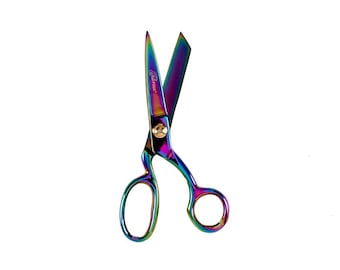 May include: Rainbow iridescent scissors with a gold screw and the word "Genuine" printed on the blade.