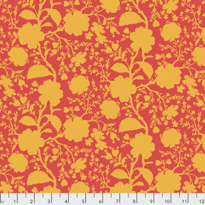 May include: A red fabric with a repeating pattern of yellow floral silhouettes. The pattern includes leaves, flowers, and small dots.