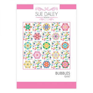 May include: A quilt pattern featuring a colourful design of circles and flowers. The pattern is called "Bubbles Quilt" and is by Sue Daley Designs.