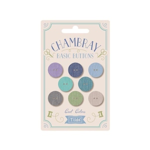 May include: A package of eight Chambray Basic Buttons in cool colors. The buttons are made of a textured fabric and have two holes. The package is labeled "Chambray Basic Buttons" and "Cool Colors" with the Tilda logo.
