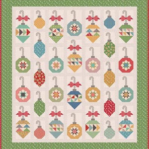 May include: A patchwork quilt featuring a repeating pattern of Christmas ornaments. Each ornament is a different color and pattern, with a red bow at the top. The quilt has a green border with a dotted pattern.