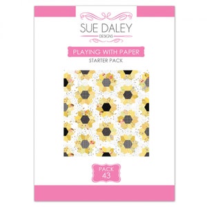 May include: A pink and white paper pattern pack for quilting, featuring a sunflower design with yellow and black fabric. The pack is labelled "Playing with Paper Starter Pack" and "Pack 43".