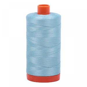May include: A spool of light blue sewing thread with an orange plastic bobbin.