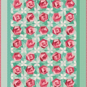 May include: A quilted blanket featuring a repeating pattern of pink rose designs on a teal background. The roses are made of various shades of pink fabric. The quilt has a border of teal and pink patterned fabric.