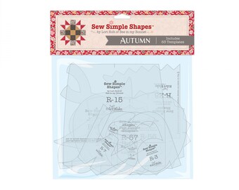 May include: A package of quilting templates labelled "Sew Simple Shapes" by Lori Holt of Bee in my Bonnet. The package includes 63 templates and features the word "AUTUMN". The templates are clear plastic and various shapes.