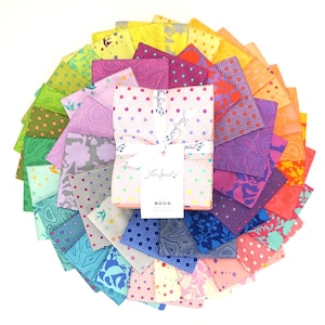 May include: A collection of 40 fabric squares in a rainbow of colours and patterns, arranged in a circle. The fabric squares are all 5 inches by 5 inches and feature a variety of designs, including geometric patterns, floral prints, and abstract designs. The fabric squares are arranged in a rainbow pattern, with the red squares at the top and the blue squares at the bottom. The fabric squares are all made of 100% cotton and are perfect for quilting, sewing, and crafting.