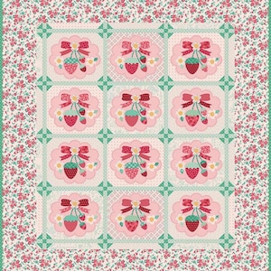 May include: A patchwork quilt with a repeating pattern of strawberries and bows. The quilt features a floral border and a grid of strawberry designs in pink, red, and green. The overall design is a charming, vintage style.