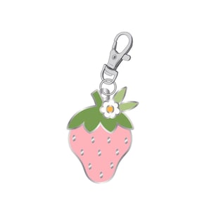 May include: A pink strawberry charm with a silver clasp and ring. The strawberry has a green top with a small white flower and a silver outline. A charming accessory.