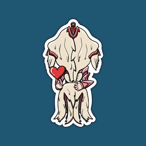May include: A die-cut sticker featuring a stylized, cream-colored creature with long, flowing hair-like segments, pink armor accents, and a small red heart held in its hand. The illustration has a thick white border and bold black outlines.