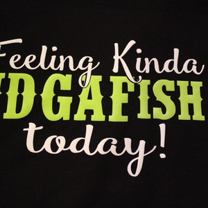 May include: Black t-shirt with white text that reads "Feeling Kinda IDGAFISH today!"