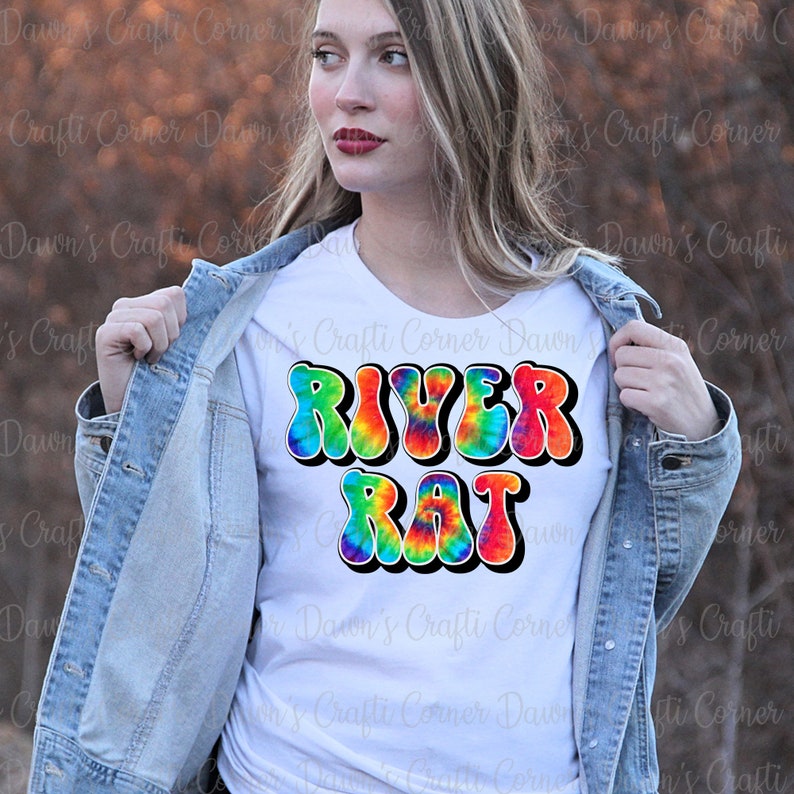 May include: A white t-shirt with a tie-dye design of the words "River Rat" in a retro font.
