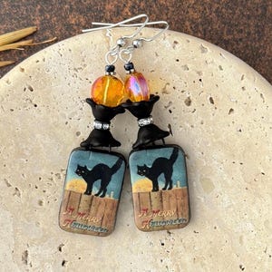 Festive black cat merry Halloween earrings • unique Halloween jewelry gifts for her • witchy cute black cat ceramic dangle earrings