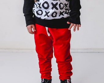 Solid red french terry joggers, leggings, harems for kids.