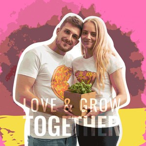 Couple with matching shirts holding a brown cardboard box with a basil plant inside - attractive packaging cardboard box for gift - cardboard box with basil seeds inside for you to grow together - grow your basil seeds and grow your love together
