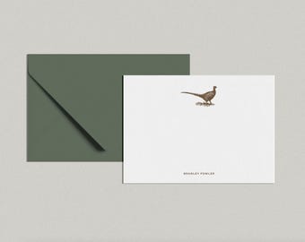 May include: A white card with a brown pheasant illustration and the text "Bradley Fowler" printed at the bottom. The card is next to a green envelope.