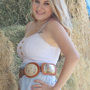 Trophy buckle leather concho belt