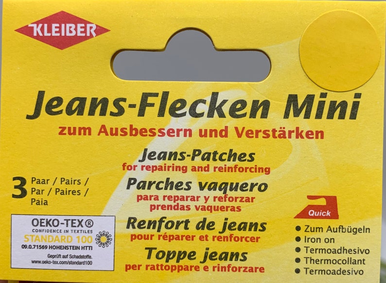 May include: A yellow package with a red and white logo that says "KLEIBER". The package contains 3 pairs of iron-on patches for repairing jeans. The text on the package says "Jeans-Flecken Mini zum Ausbessern und Verst&auml;rken" in German, "Jeans-Patches for repairing and reinforcing" in English, "Parches vaquero para reparar y reforzar prendas vaqueras" in Spanish, "Renfort de jeans pour r&eacute;parer et renforcer" in French, and "Toppe jeans per rattoppare e rinforzare" in Italian. The package also has a small iron icon with the word "Quick" next to it.
