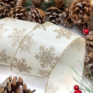 2.5 inch wired ivory satin ribbon with gold glitter Snowflake trim for bows, wreaths and holiday decorations