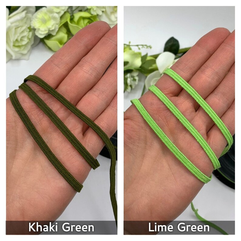 May include: Two spools of elastic cord, one in khaki green and one in lime green. The cord is shown wrapped around a hand.