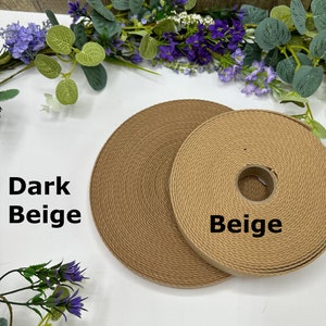 May include: Two rolls of beige webbing are displayed, one in a darker shade labeled "Dark Beige" and the other labeled "Beige." The webbing has a textured appearance. The image is set against a white background with floral accents.