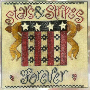 May include: Cross-stitch embroidery design featuring a red, white, and blue American flag with stars and stripes. The text "Stars & Stripes Forever" is stitched below the flag.