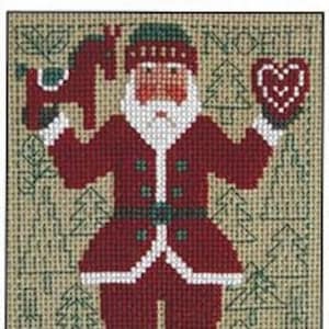 May include: A red and white Santa Claus figure holding a wooden toy horse and a heart-shaped cookie. The figure is standing in front of a green background with stylized pine trees.
