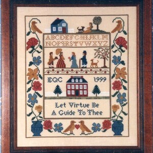 May include: Framed cross-stitch sampler with a brown wooden frame. The sampler features a cream-colored background with embroidered images of houses, people, birds, flowers, and the text "Let Virtue Be A Guide To Thee" and the year 1999.