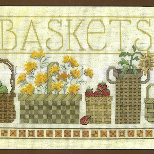 May include: A cross-stitch pattern featuring five baskets filled with various items, including apples, strawberries, flowers, and a sunflower. The word "BASKETS" is stitched above the baskets.