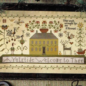 May include: A cross-stitch pattern featuring a yellow house with a green roof and a red sled. The text "A Yuletide Welcome to Thee" is stitched below the house. The text "This work wrought by me P.Stewart" is stitched in the upper right corner.