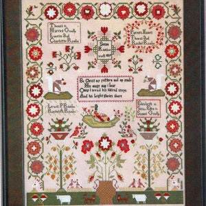 May include: Framed cross-stitch sampler with a light pink background, featuring floral and geometric patterns in red, green, and white. Includes names and dates, with text reading "Be Christ my pattern and my guide".