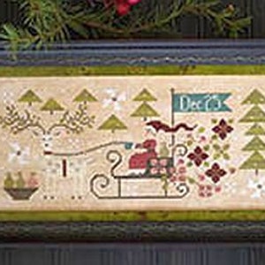 May include: A cross-stitch pattern featuring a red-clad figure riding a reindeer-drawn sleigh through a wintery forest scene. The text "Dec 25" is visible on a banner above the sleigh.